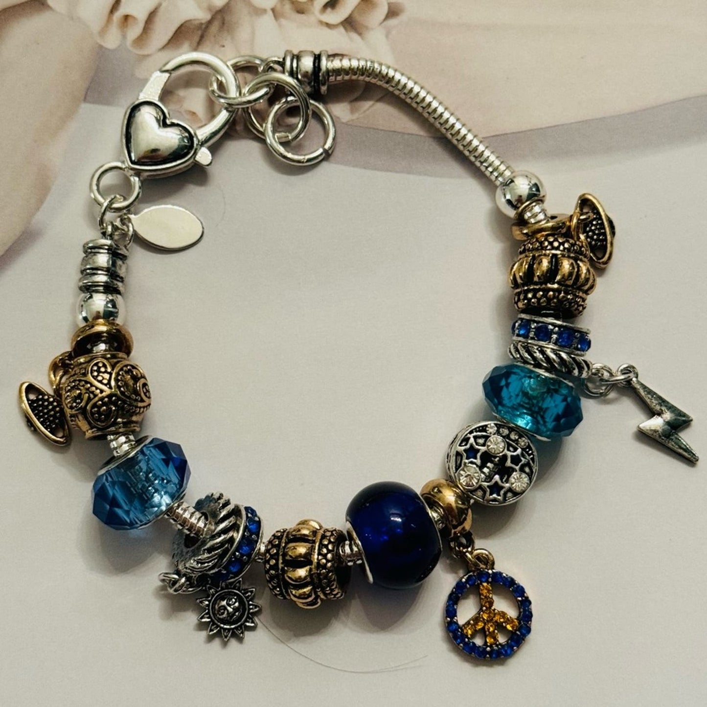 Gold and silver Charm bracelet